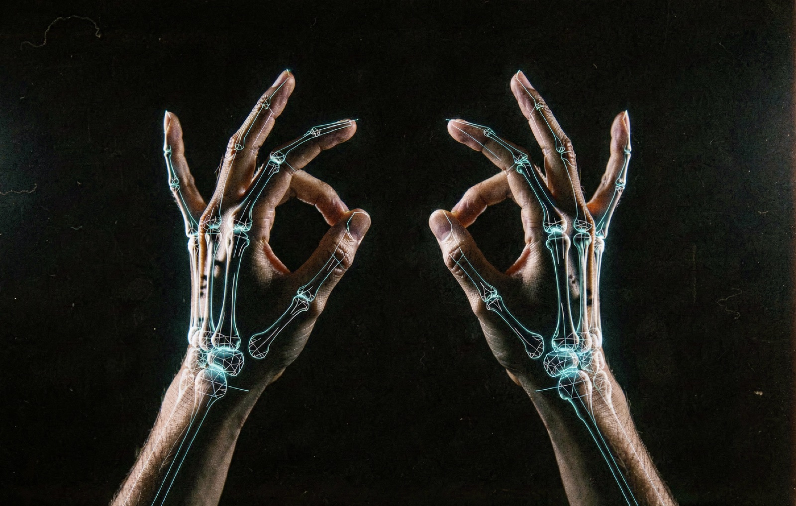 Two hands playing an invisible instrument, traced by glowing wireframe skeleton lines